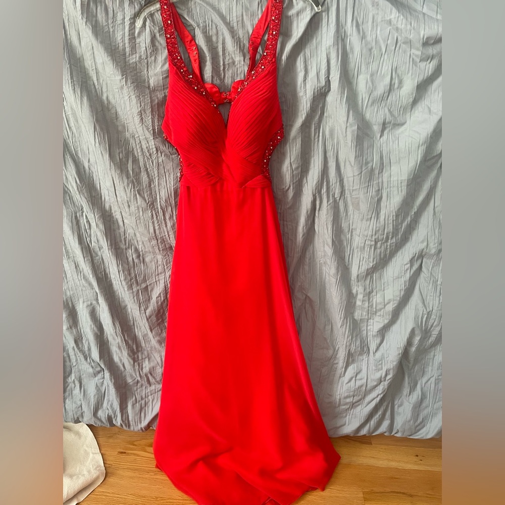 Beautiful open back red prom dress. Detailing is beautiful and only worn twice.